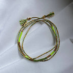 Sukh lucky charm cord bracelet in orange